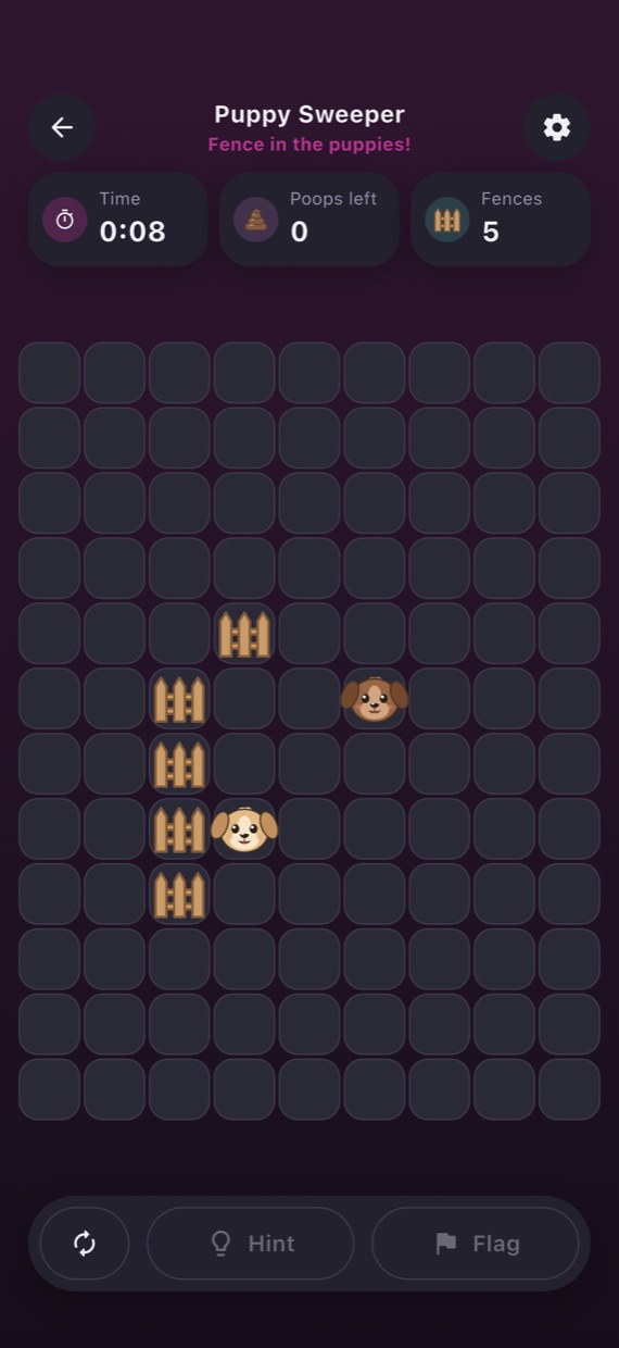 Two puppies in the Puppy Yard, partly fenced in, in dark mode